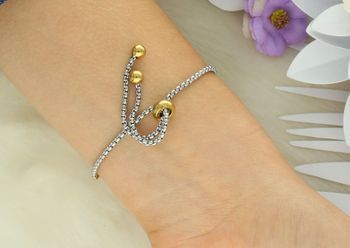 Oryginalna bransoletka Nomination Italy Milleluci 028021 038 z zawieszką księżyca i serca, zdobiona cyrkoniami. Złocona stal szlachetna, regulowana długość, certyfikat autentyczności (1).jpg